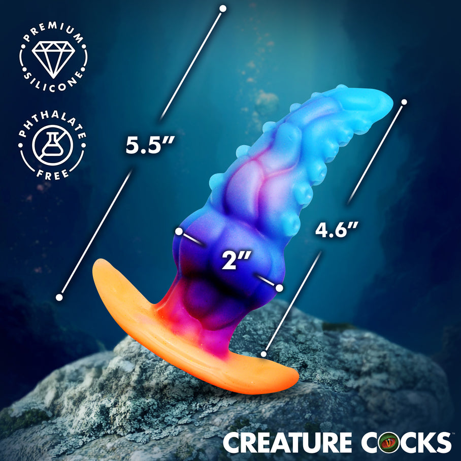 GLOWTOPUS fantasy anal plug showing comfortable 5.5 inch length and tapered
2 inch wide shape 