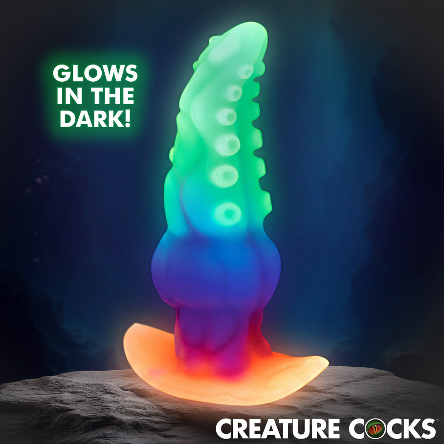 GLOWTOPUS silicone plug glowing softly in the dark showing playful
glow-in-the-dark feature