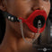 Plugged silicone feeding gag in bold red with black strap for couples
bondage exploration 