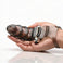 Bang Bang P-Spot Vibrating Finger Glove resting in a hand to demonstrate size, featuring a textured smoke-tinted sleeve and built-in vibrating bullet