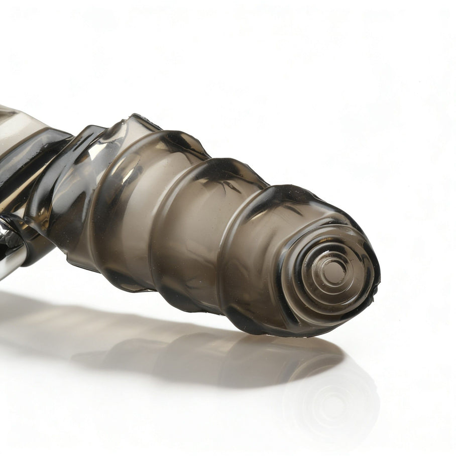 Detailed view of the textured rounded tip with spiral stimulation pattern and raised ridges designed to enhance prostate massage sensations