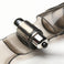 Close-up of the integrated bullet vibrator mounted within the smoke-tinted finger glove, highlighting the compact stimulation motor and flexible sleeve design