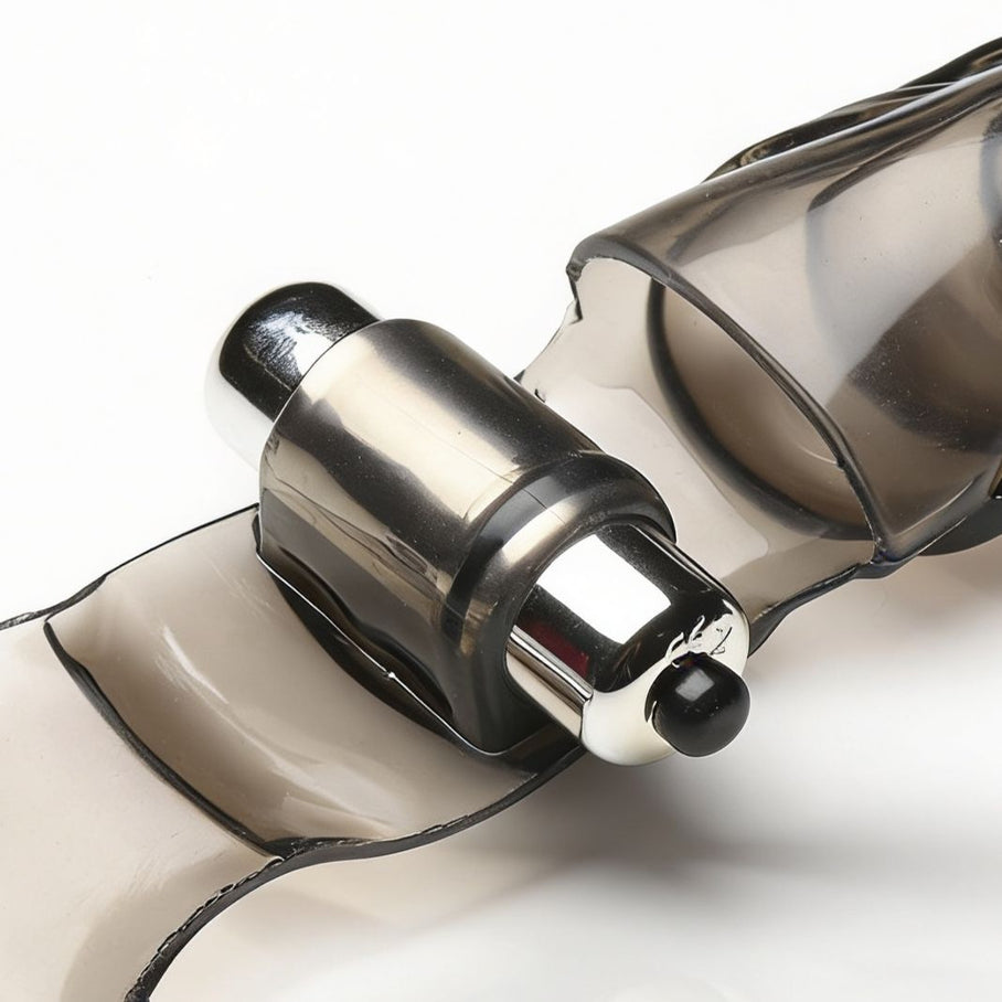 Close-up of the integrated bullet vibrator mounted within the smoke-tinted finger glove, highlighting the compact stimulation motor and flexible sleeve design