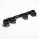 Angled view of the Deluxe Rigid Spreader Bar highlighting the four padded faux leather cuffs, rigid support bar, adjustable straps, and metal buckles