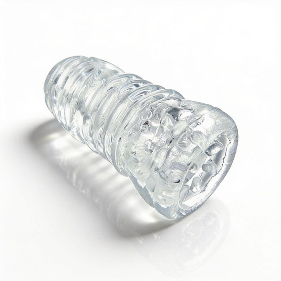 Angled product view of the Palm-Tec LX20 Intense Stroker highlighting the clear flexible sleeve and textured outer design