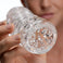 Close-up of the Palm-Tec LX20 Intense Stroker opening showcasing the clear sleeve material and detailed internal stimulation texture
