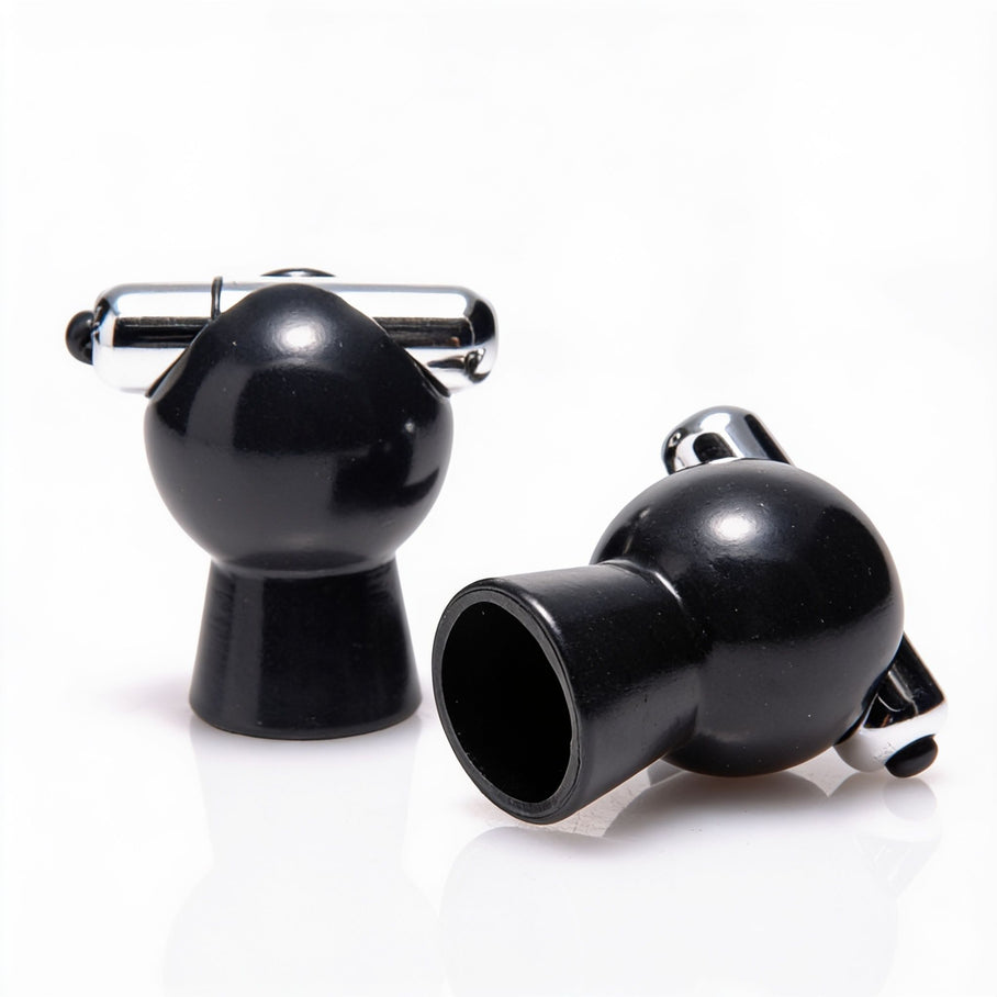 Pair of vibrating nipple suckers with black suction chambers and chrome vibration bars designed for targeted nipple stimulation and teasing sensations