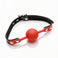 red silicone comfort ball gag with adjustable black strap and silver buckle hardware