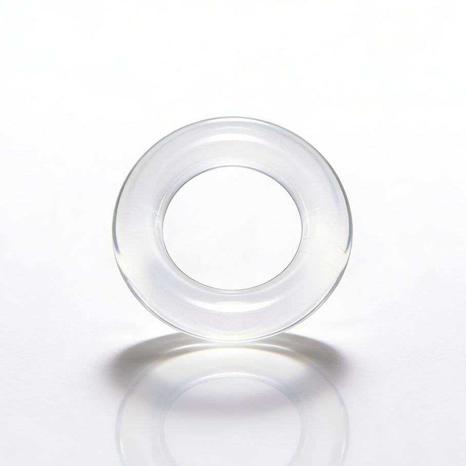 Close-up product view of the Universal Super-Stretch Cock Ring highlighting the soft clear material and thick stretchable construction for enhanced support and comfort