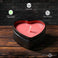 UV reactive heart drip candle lit safely on a nightstand