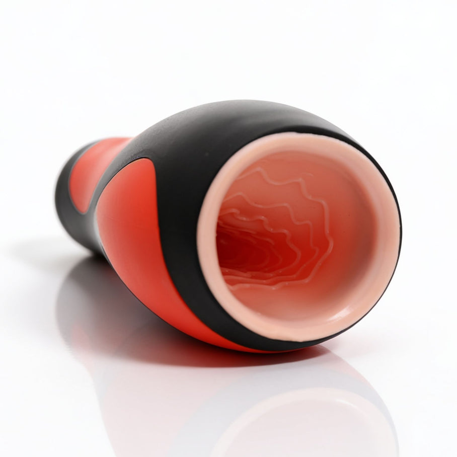 Open end view of the Vibra Head Bionic Auto Stroker highlighting the soft realistic sleeve opening and internal textured canal